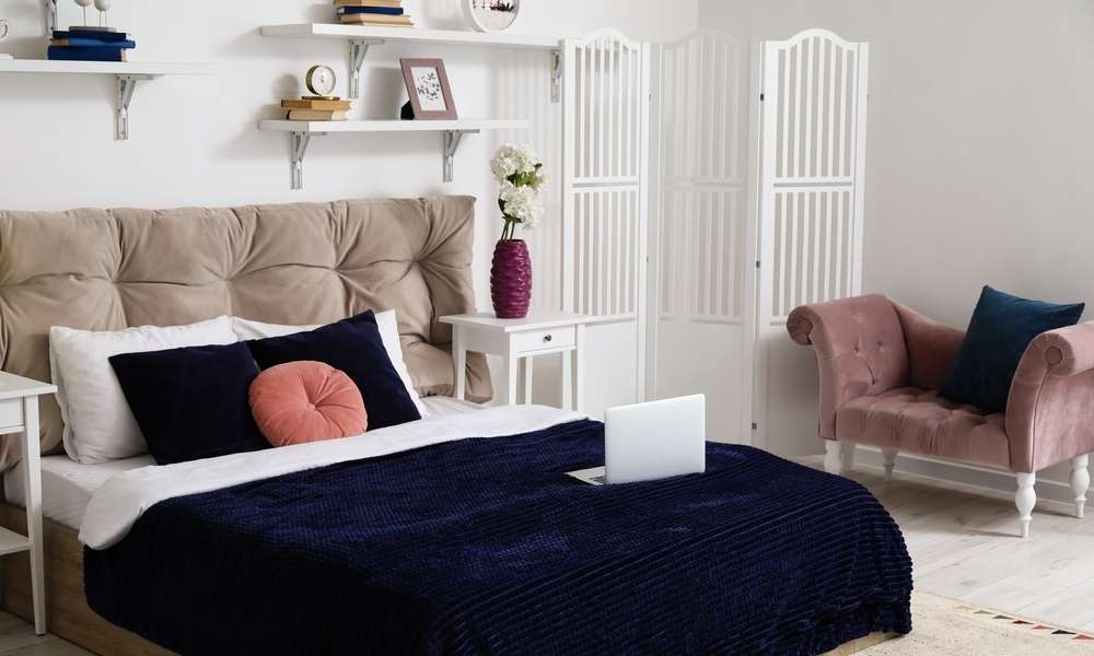 Strategically Place Your Furniture To Divide A Bedroom Into Two Rooms