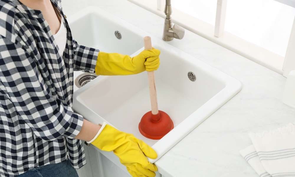 Use A Plunger To Unclog A Double Kitchen Sink With Standing Water