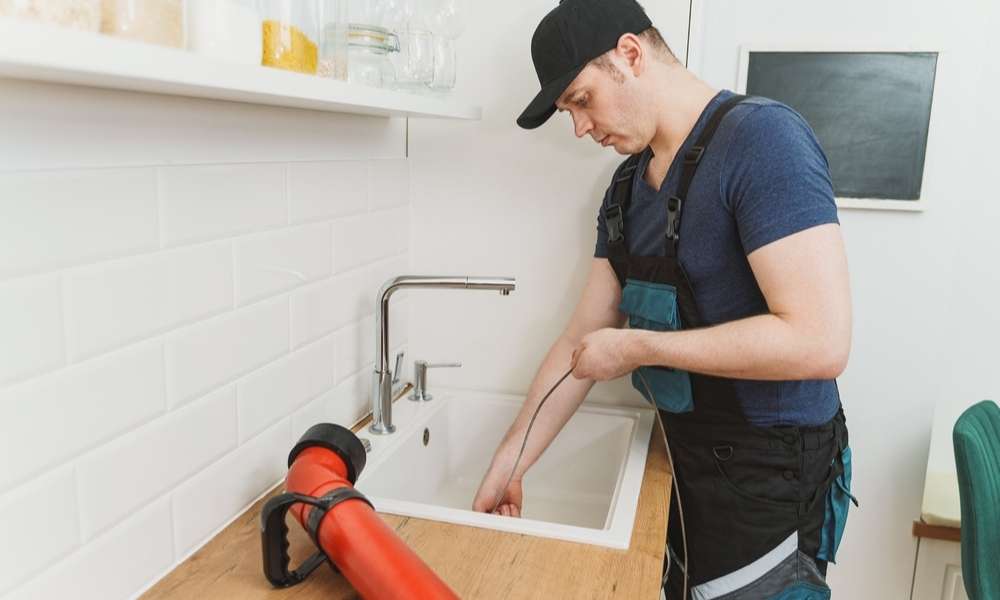 Snake The drain To Unclog A Double Kitchen Sink  