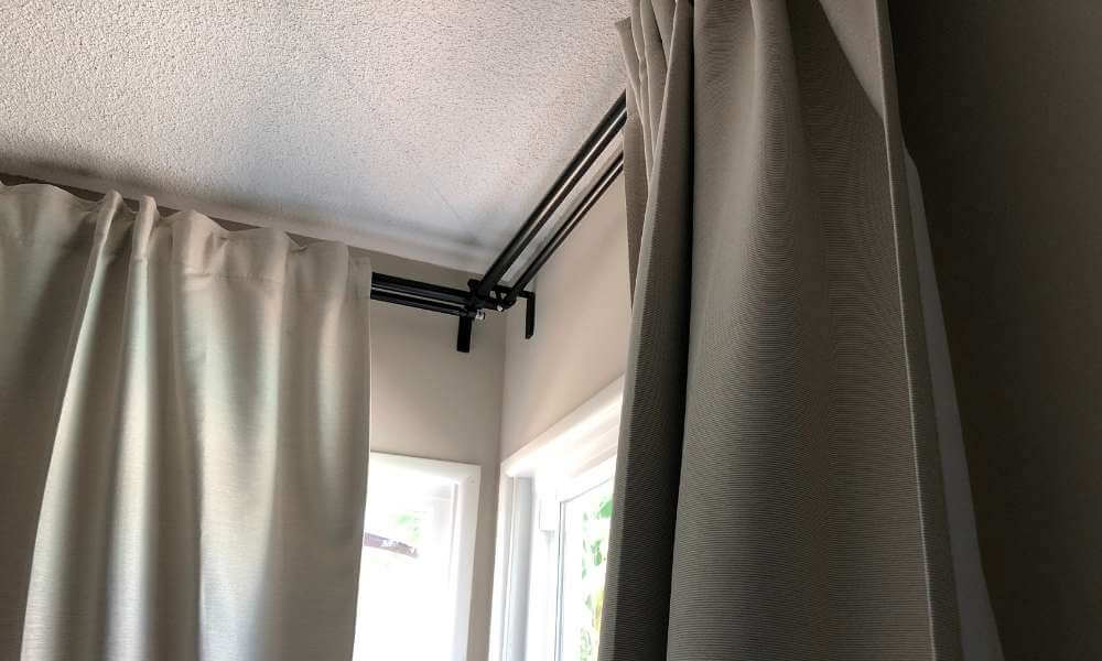 Silver Curtains On A Black Curtain Rod
